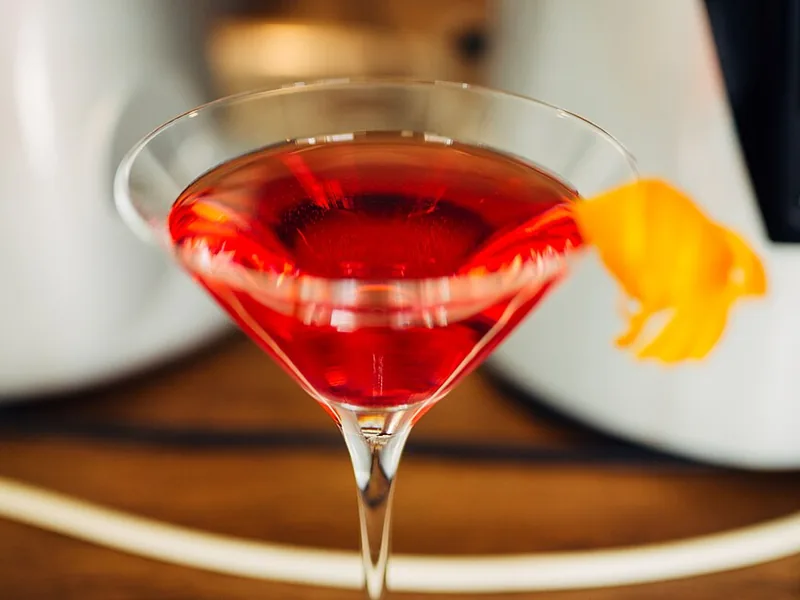 Cocktail garnished with citrus twist